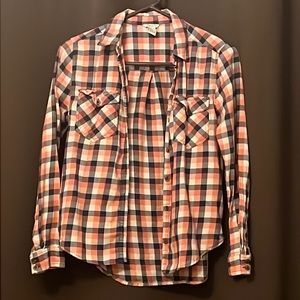 Plaid pink and blue button-down shirt.